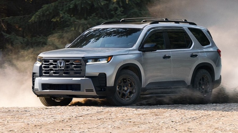a Honda Pilot driving on gravel