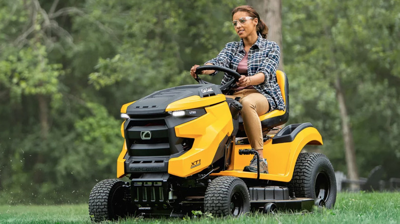 Person using Cub Cadet riding mower