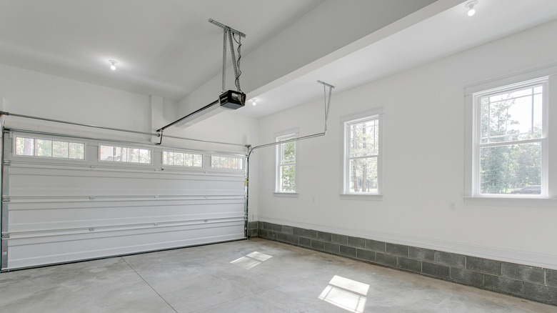 Bright Garage Space With Dual Overhead Doors Open.
