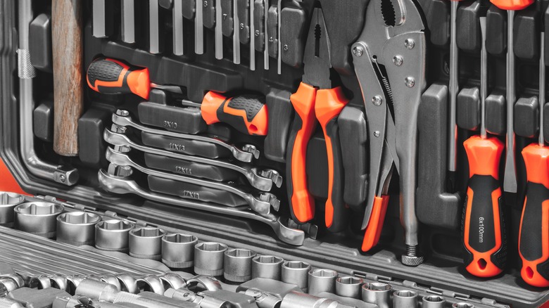 A toolbox full of wrenches, screwdrivers, pliers, and other tools