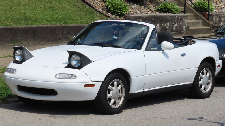 1990 Mazda MX-5 Miata photographed at the 33rd Annual Beaver Falls Car Cruise in Beaver Falls, Pennsylvania. Finished in Crystal White