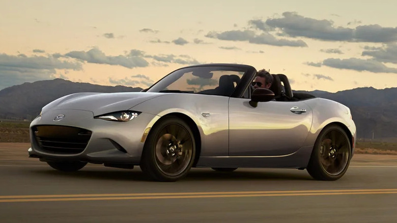 A 2024 Mazda MX-5 Miata cruising on the road