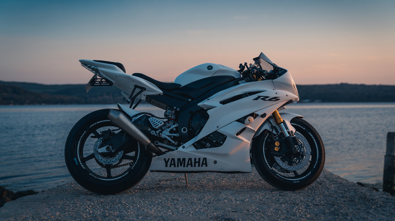 White Yamaha R6 parked next to a body of water