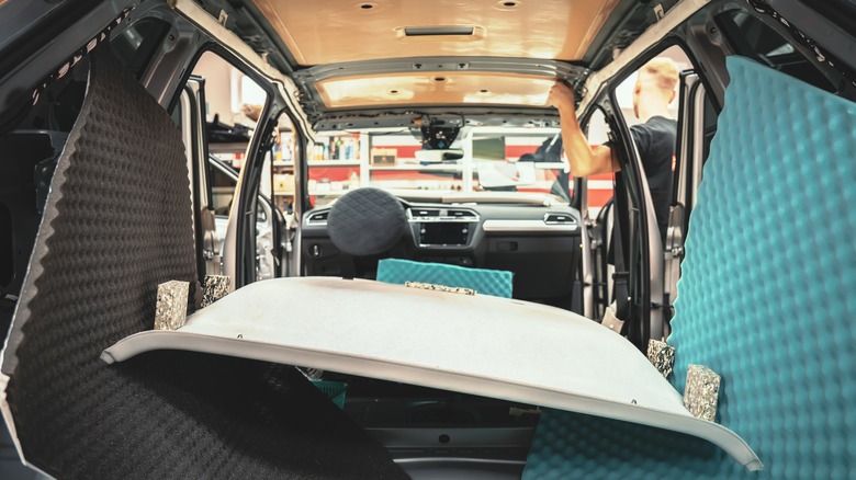 car in garage with removed headliner