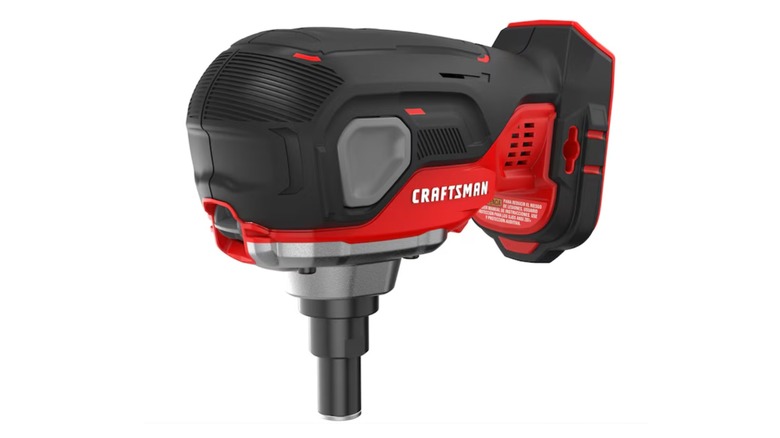 man holding palm nailer