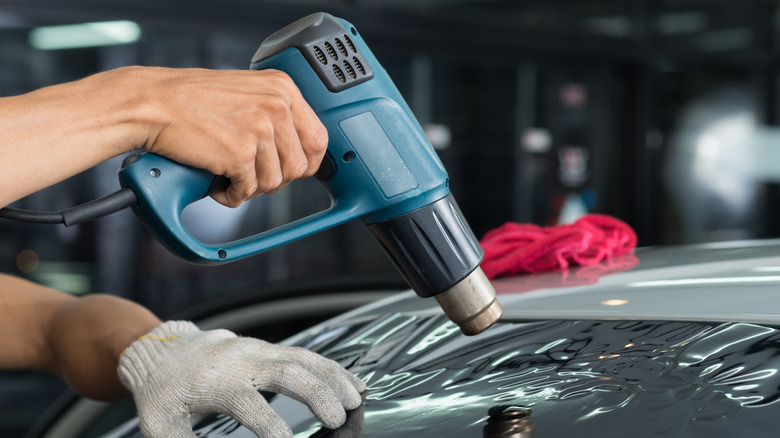 Person using a heat gun