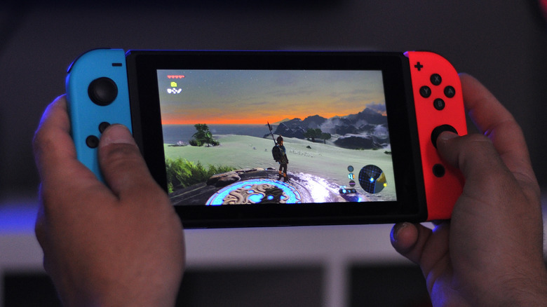 Man playing Nintendo Switch