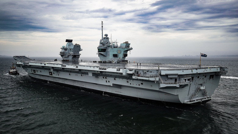 aircraft carrier, Prince of Wales, leaving Rosyth dry dockyard