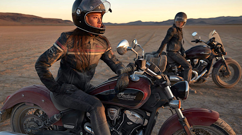 People sitting on Indian Motorcycles in desert