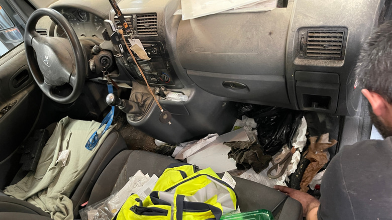 A very messy interior of a Peugeot