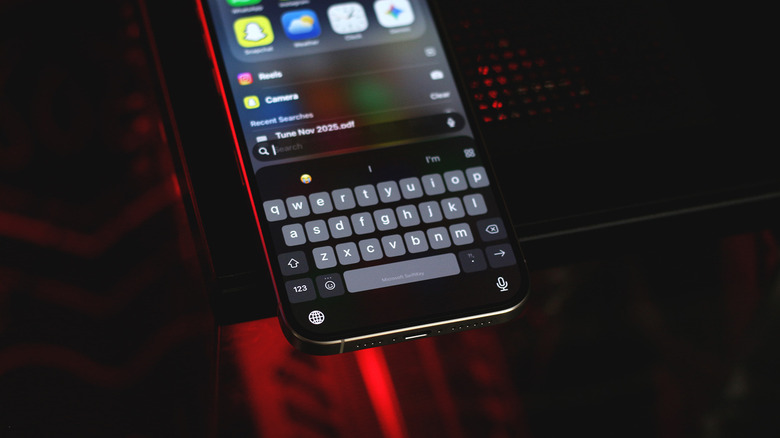 An iPhone displaying a SwiftKey keyboard