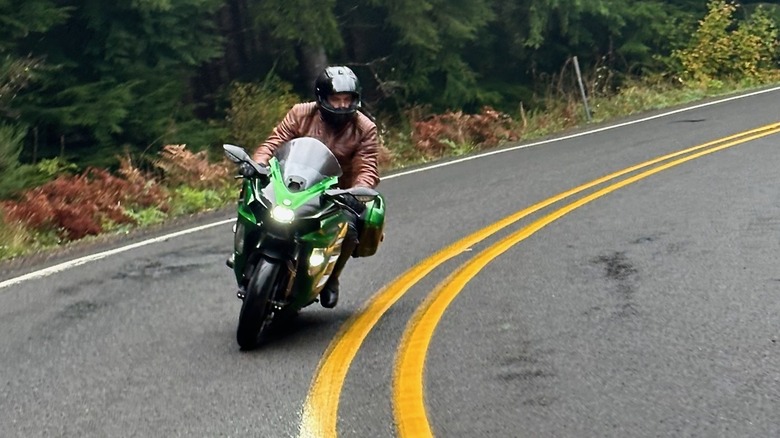 Kawasaki Ninja H2 SX being ridden in the forest