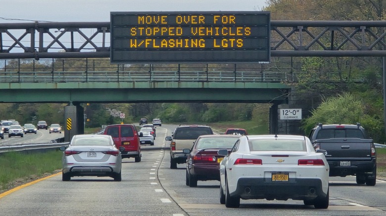 Sign reminding drivers to move over for flashing lights