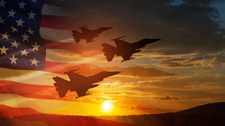 fighter jets flying with American flag superimposed over image