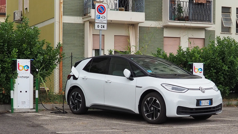 Front view of a Volkswagen ID.3 plugged into a public charging station