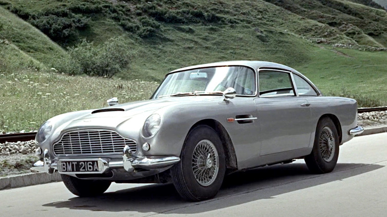 Aston Martin from Goldfinger sitting on the side of the road