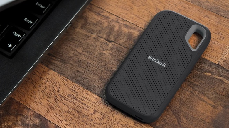 SanDisk Extreme Go Portable SSD next to a laptop
