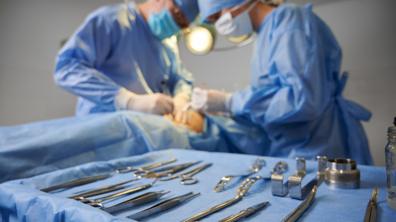 two surgeons over operating table