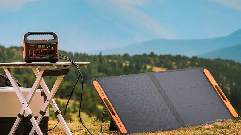 Charging Jackery portable power station with solar panel