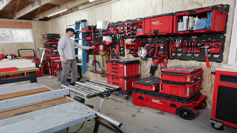 Man in garage with Milwaukee tools