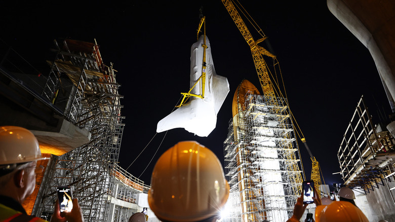 Space Shuttle Endeavour being lifted into place at the Samuel Oschin Air and Space Center in Los Angeles