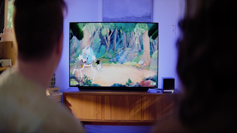 People playing games on their television through a Steam Machine