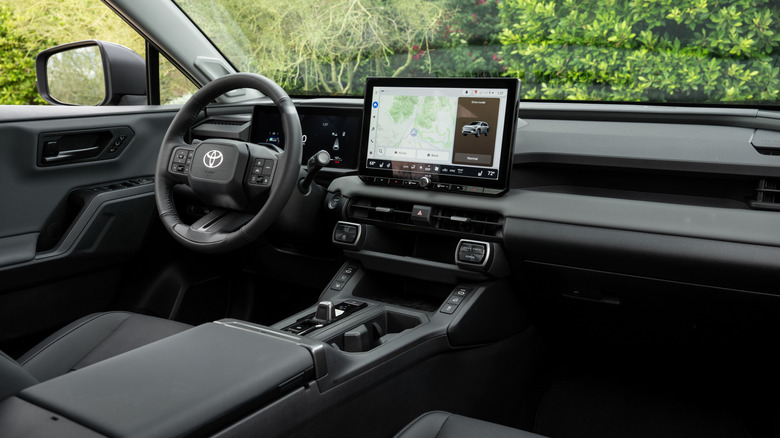 Interior shot of the 2026 Toyota RAV4, facing the driver's side from the passenger seat