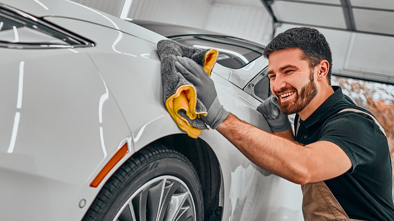 man buffing car