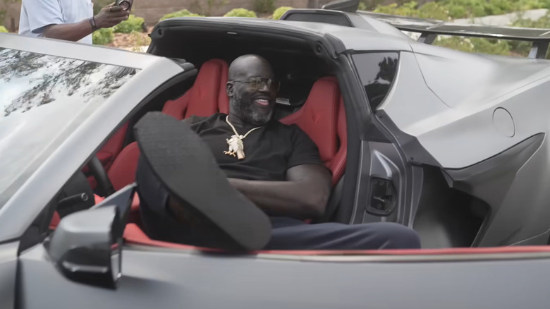 Shaq stretches out in his brand new C8 Corvette Z06