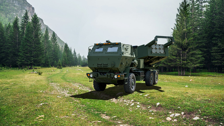 HIMARS missile launcher parked in mountain clearing