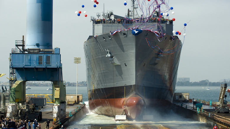 Warship being launched from a slipway
