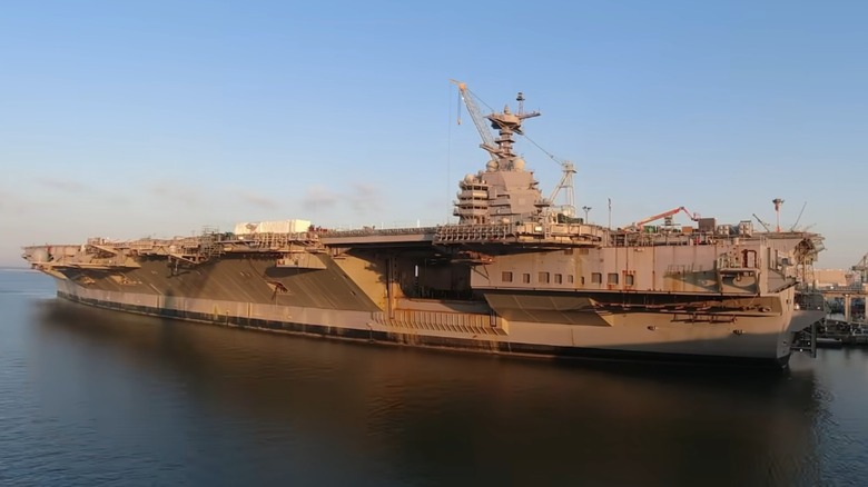 USS John F. Kennedy docked at sunset