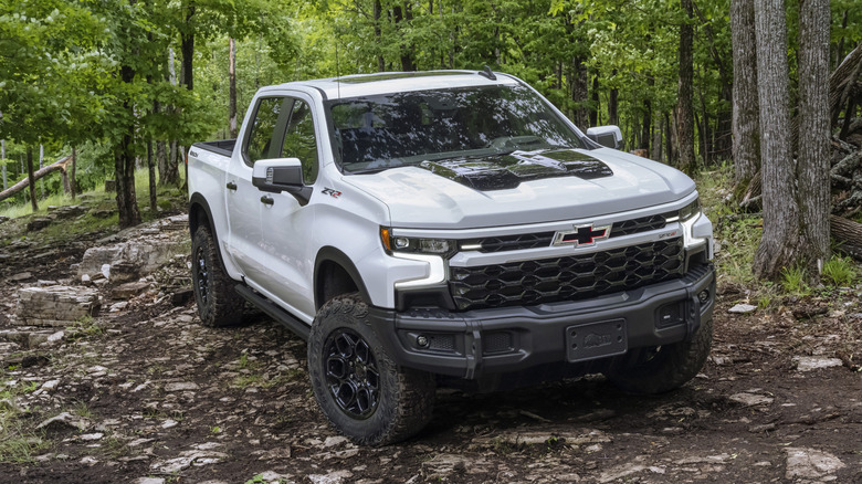 2025 Chevrolet Silverado ZR2 off-roading in a forest
