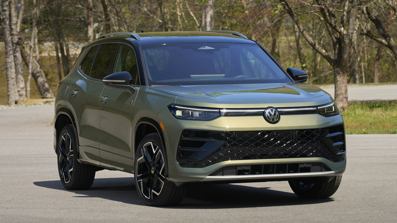 Volkswagen Tiguan next to blossoming trees