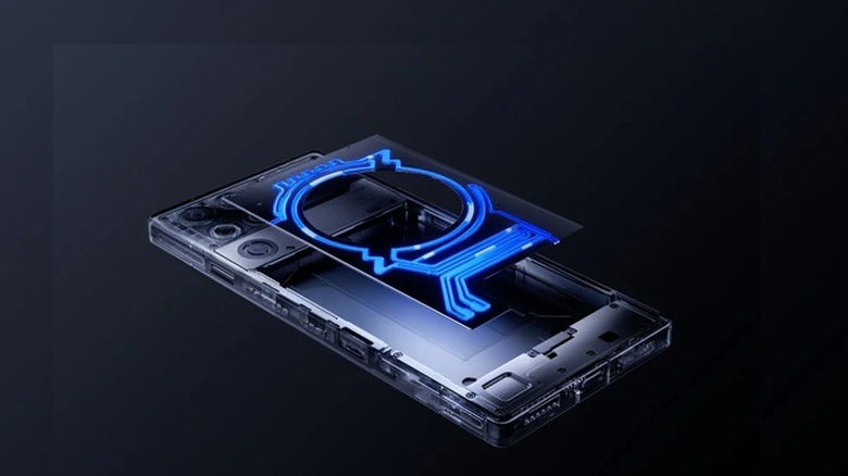 RedMagic Pro 11 phone facedown with back liquid-cooling panel floating above it