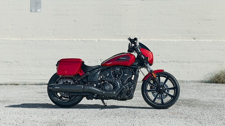 Red Indian Sport Scout RT parked in front of a white wall