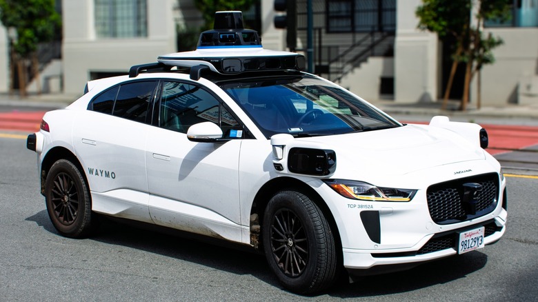 Waymo driving down road by itself