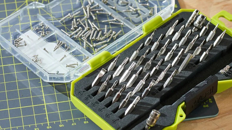 An opened Ryobi precision screwdriver kit on a table.