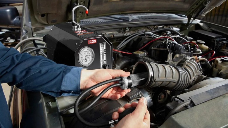 Icon Diagnostic Smoke Machine being hooked up to car