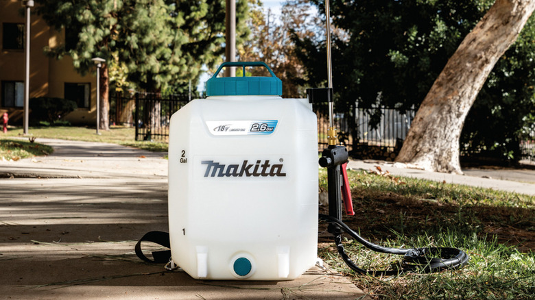 Makita 18V backpack sprayer resting on ground