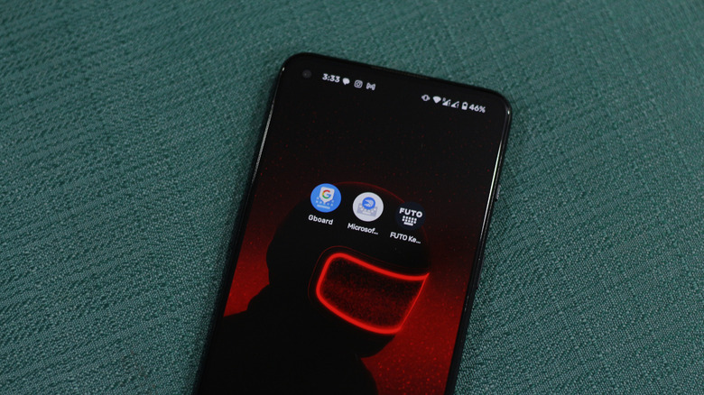 Gboard, SwiftKey, and FUTO keyboards on an Android phone