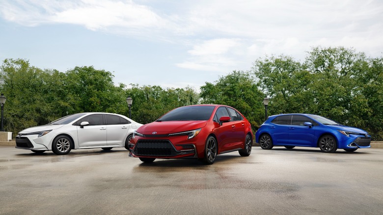 Red, white, and blue 2024 Toyota Corolla sedan, Hybrid, and hatchback parked