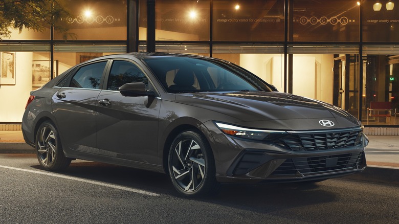 Front 3/4 view of Hyundai Elantra in urban setting