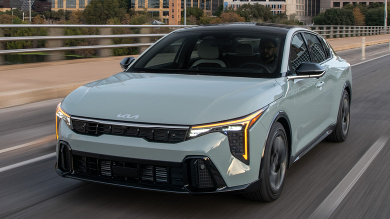 Front 3/4 View of 2026 Kia K4 in urban setting