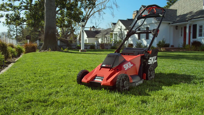 Unused Skil PM4910-10 on front lawn with houses in the background