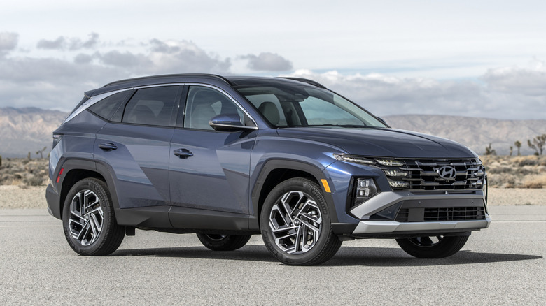 Blue Hyundai Tucson parked in the desert