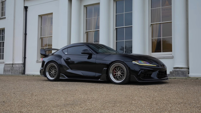 A side on shot of Liam Lawson's custom AUTOID A90 Toyota Supra