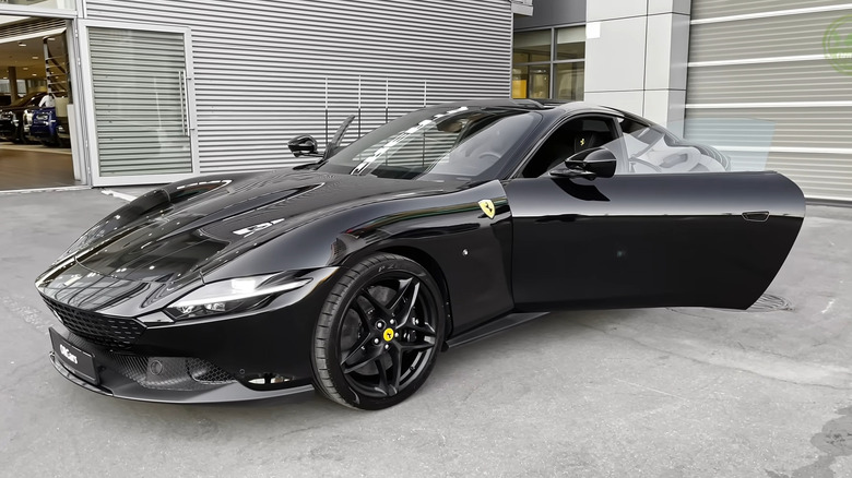 A side on shot of a black Ferrari Roma