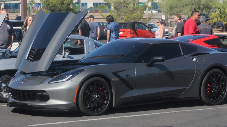 Chevy Corvette on display with open hood.