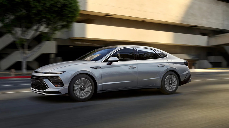 White 2026 Hyundai Sonata model speeding on a street